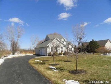 Exterior Front. Extra wide blacktop driveway with 