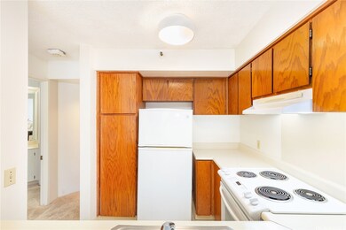 Here is the kitchen. On the left is the doorway to