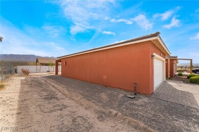 View of side of property with driveway, stucco sid