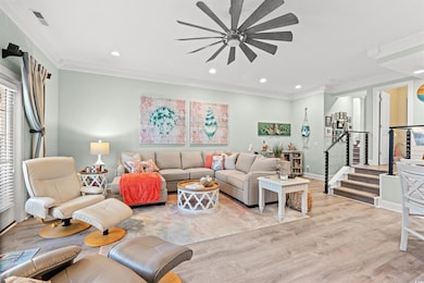 Living room with light wood-type flooring, ceiling