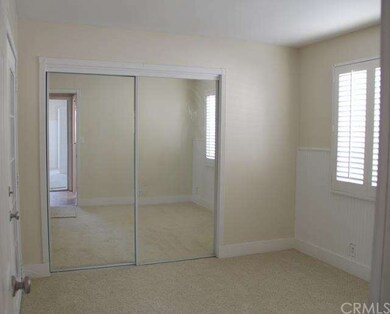 Bedroom #2 w/shutters and mirrored wardrobe