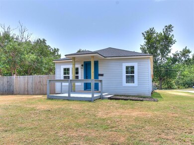 View of front of property with a deck and a front 
