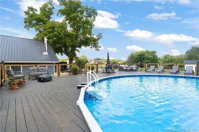 ABOVE GROUND POOL WITH ENORMOUS DECK!