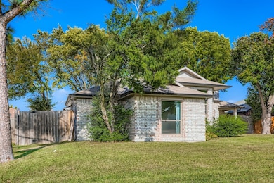 View of side of home with brick siding