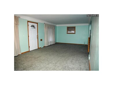 27XX12 Living Room With Wood Floor Under Newer Carpet, Part Of The Room Can Be Used As Dining Room