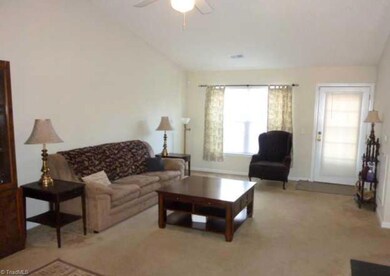 Enter into large living area with vaulted ceiling.