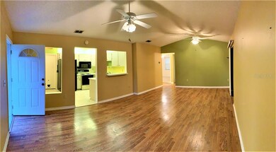 Great room With Cathedral Ceilings, Wood Floors an