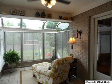 Quiet, getaway Sunroom, to curl up and read a book or watch the critters run around the yard.
