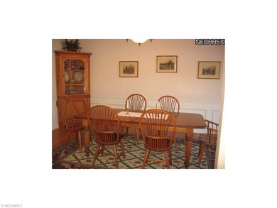 DINING ROOM AREA OFF FOYER AND KITCHEN. CHAIR RAIL