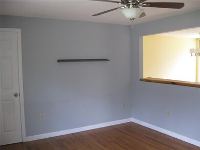 Living room with coat closet.