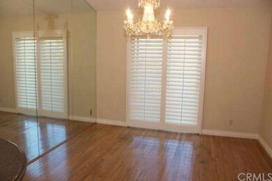 Dining room with chandelier and door opens to larg