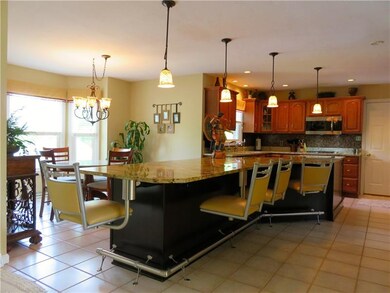 Unique Kitchen Island with attached Bar Stools!