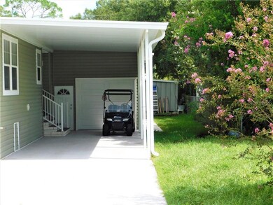 CARPORT LEADING TO BRAND NEW GARAGE WITH FRONT AND