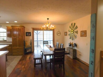 DINING AREA W/PATIO DOORS TO DECK OVERLOOKING VALL