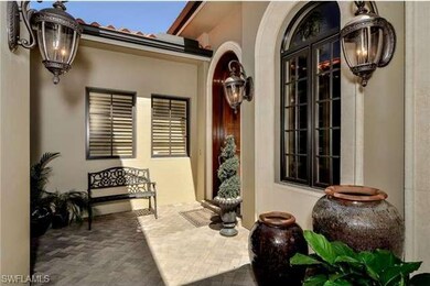Custom pavered court-yard entrance with mahogany a