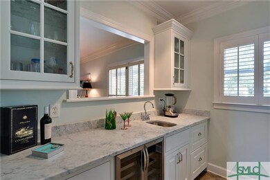 Pour a drink at the new wet bar with granite count