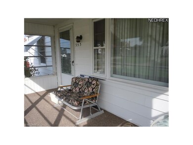 Enclosed front porch.