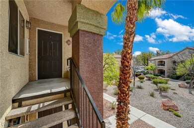 Entrance to property with stucco siding