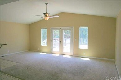 Family room open to kitchen and dining area.