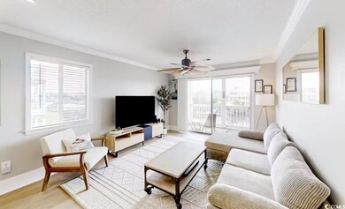 Living room with ornamental molding, healthy amount of natural light, a ceiling fan, and light wood finished floors