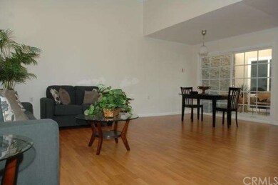 The large living room has a vaulted ceiling with s