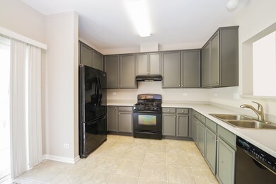 With freshly painted cabinets, Corian countertops,