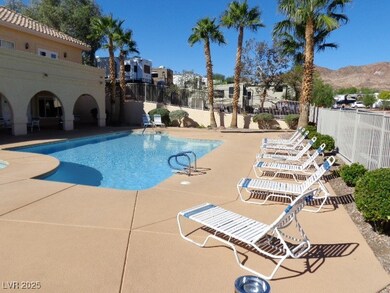 Community pool with a patio