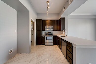 Kitchen with view to separate laundry room.  Laund