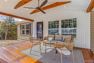 Deck featuring an outdoor living space and a ceiling fan