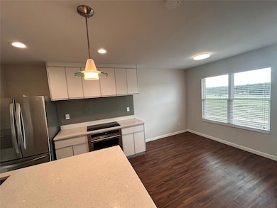 Kitchen with stainless steel appliances, light co