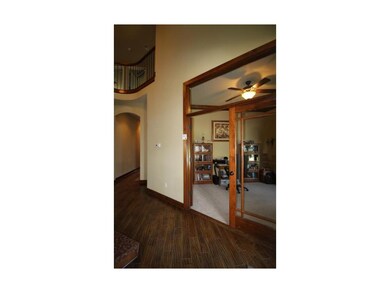 Den on Main Level with Wood French Doors