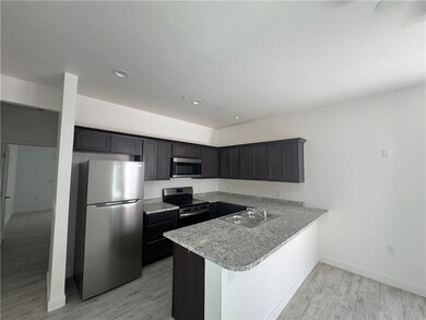 Kitchen with appliances with stainless steel finis