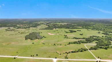 Birds eye view of property with a rural view