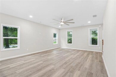 Unfurnished room with ceiling fan, light wood finished floors, and recessed lighting