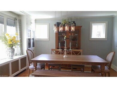 Sunlight beams stream thru this dining room.  Two 