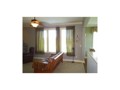 Livingroom has of natural lighting and fan.
