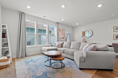 Living area with recessed lighting, wood finished 