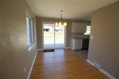 Sliding door from dining room leads to rear deck.