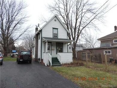 Exterior Front. The driveway/parking area is share