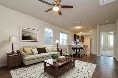 Living Room 
This photo has been virtually staged to show the potential
of the home, and to help show the
scale of the furniture the room can
accommodate.