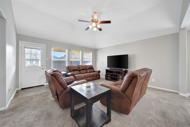 The spacious family room is a wonderful space where your family can gather.