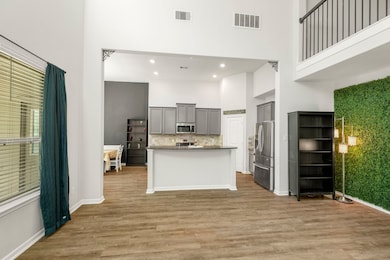 From this view, the living room extends into a coz