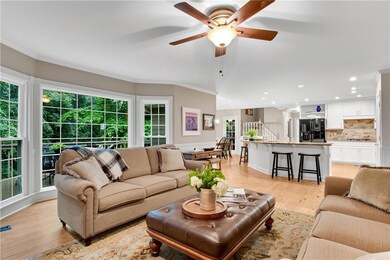 Kitchen opens to both family room and vaulted breakfast room