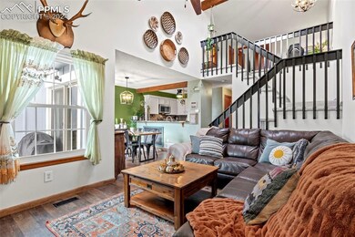 Living room with hardwood / wood-style flooring, b
