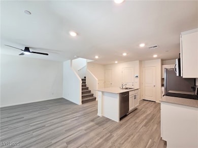 Kitchen featuring stainless steel appliances, a si