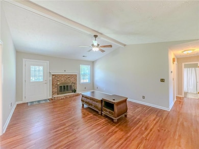 Unfurnished living room with light wood-style floo