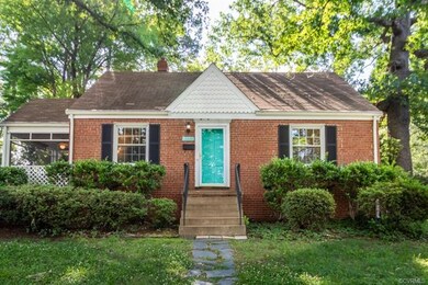 Established landscaping and a quaint slate walk leads to front door of this sweet Cape!