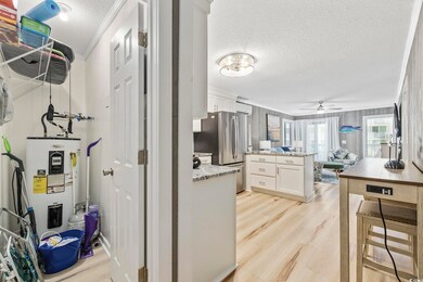 Interior space featuring an AC wall unit and water