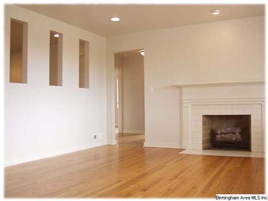 Living room with gas-log fireplace, recessed light