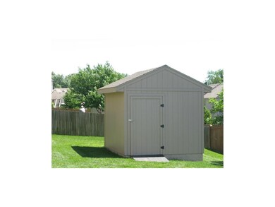 Storage shed at rear of home